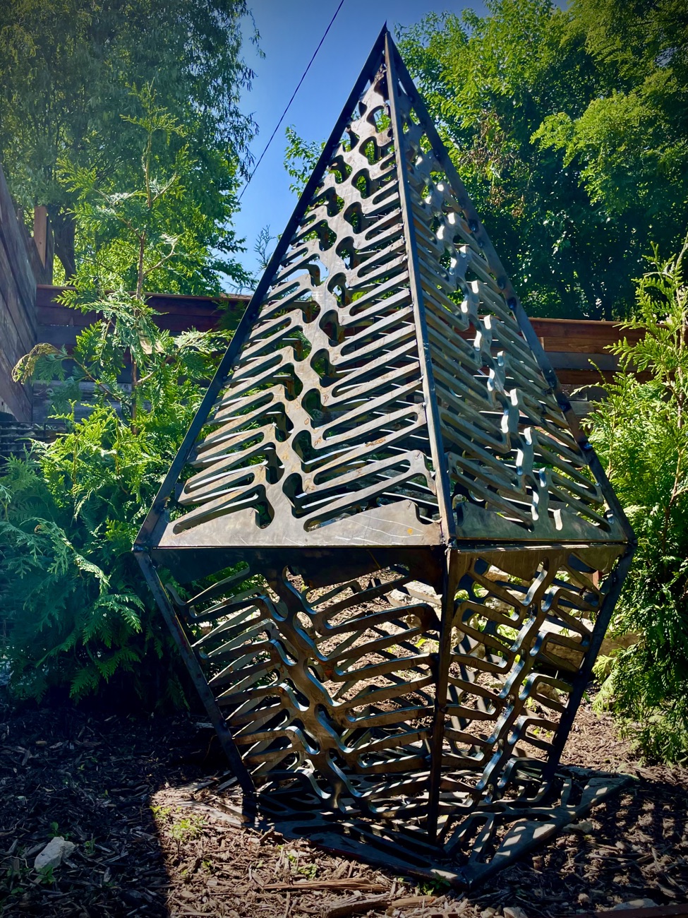 Pyramidal salvaged-metal garden sculpture